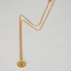 Collar Dorado Con Colgante Redondo Sol Y Circonita Negra